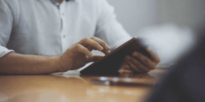 Businessman using a tablet.
