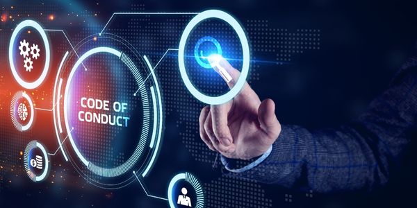 Young businessman working on a virtual screen of the future and sees the inscription: Code of conduct