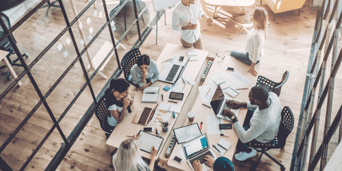 Group of young multiracial creative people working together in modern office.